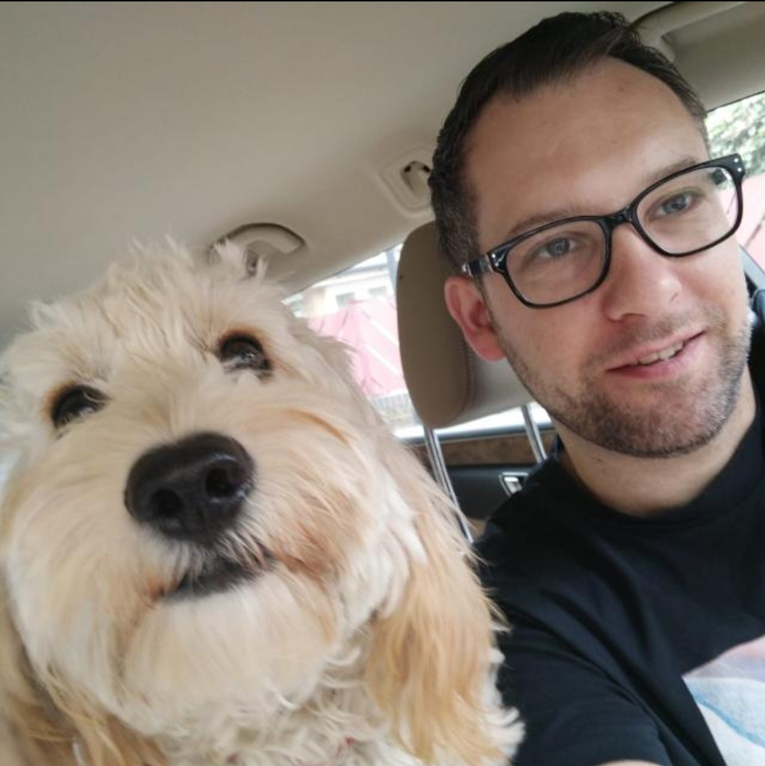 picture of Conor with a dog